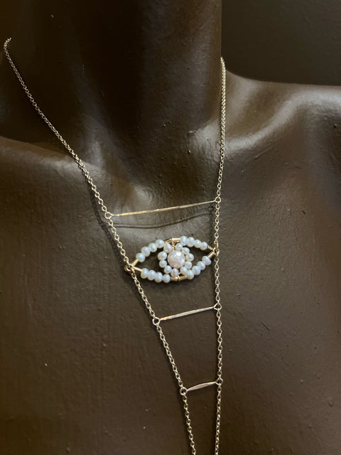Floral cupids eye necklace